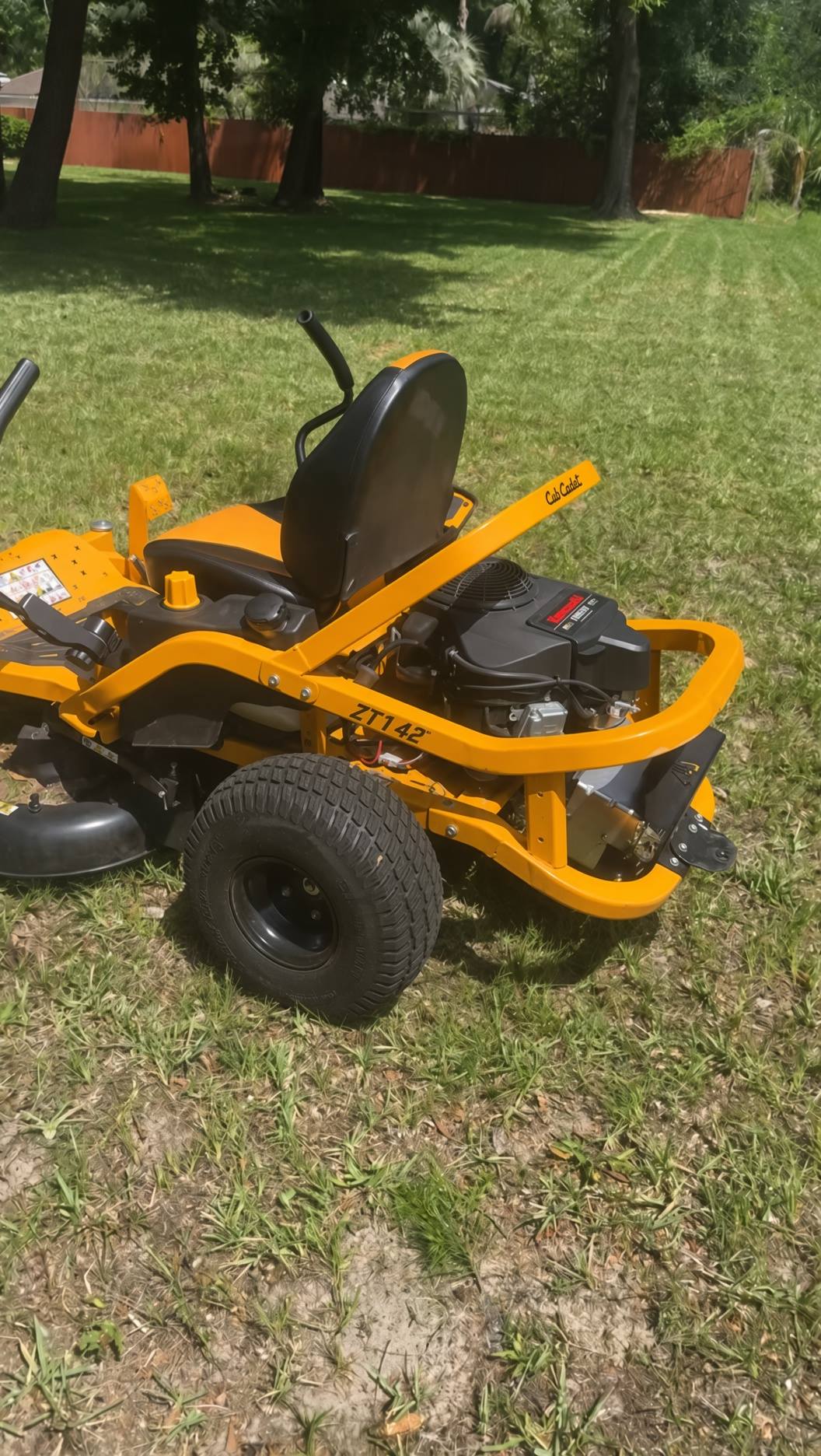 Zero-turn mower on a freshly cut lawn